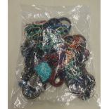 A sealed bag of costume jewellery.