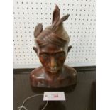 Carved hard wood bust of  male in Malaysian headdress (height 18cm)