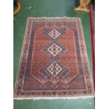 Large modern Shiraz-style rug with three medallions on a red and dark blue ground depicting chickens