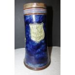 Royal Doulton blue glazed stoneware jug, moulded with two heraldic emblems and central escutcheon