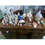 A large collection of Edwardian German and other hand-painted porcelain pincushion half dolls of