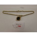 18ct gold swivel and pivot engraved onyx and jade seal on an 18ct gold link chain, 36g
