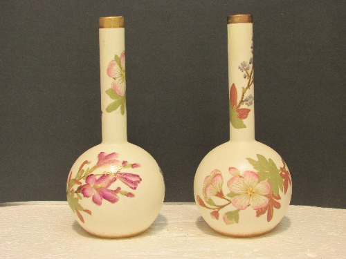 Pair of cream ground Worcester bottle vases with narrow cylindrical necks, painted with various