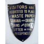 A c1900 shield-shaped enamelled notice 'VISITORS ARE REQUESTED TO PLACE ALL WASTE PAPER BANANA AND