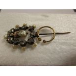 An unusual Victorian pearl and paste hat brooch with nine chip diamonds and gold swivel hoop with