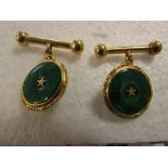 Pair of 18ct gold fob buttons set with nephrite disks with central gold star, together 8.7g