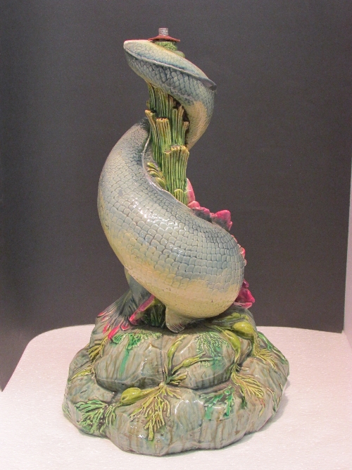 Pottery lamp base formed as a crested fish with its tail wrapped around a central column of reeds on - Image 2 of 3