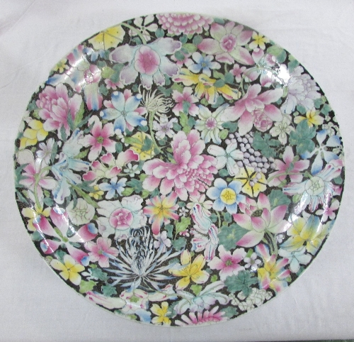 Large Chinese porcelain dish enamelled in the famille rose palette against a black ground with - Image 4 of 5