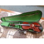 A violin labelled within 'Adolf Durenzy', with bow and in a rigid case (length of violin 60cm)