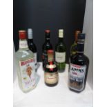 One litre bottle of imported Lamb's Navy rum, one litre bottle of imported Beefeater London dry gin,