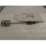 14ct white gold stick pin set with solitaire diamond (estimated at 0.35 carat) in oblong filigree