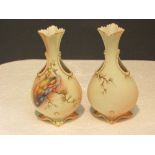 Pair of Locke & Co blush ground vases decorated with peacocks in pine branches and gilded