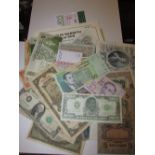 A collection of foreign bank notes including Japanese government 100 dollar note; Bank of Cyprus