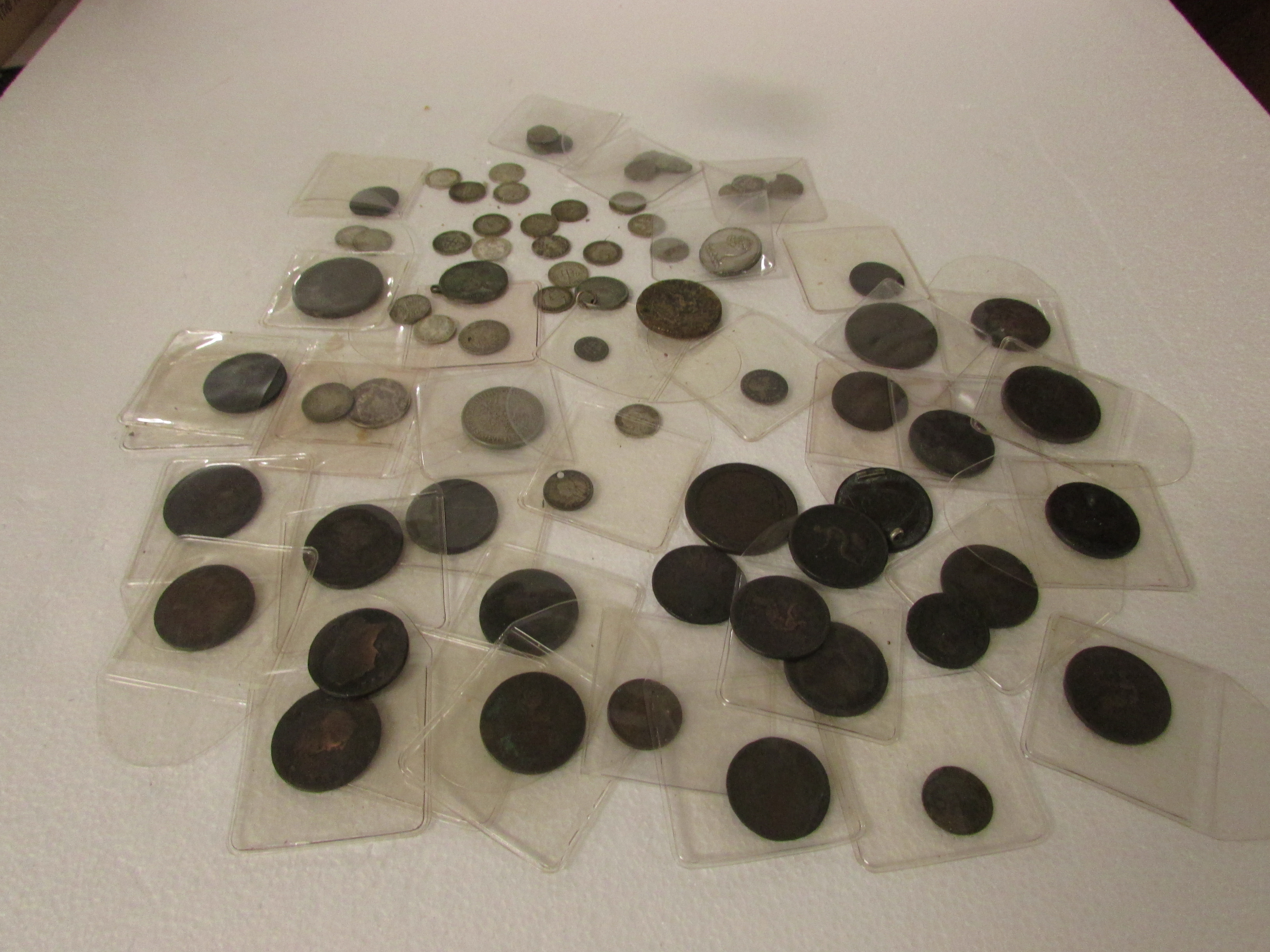 A damaged Valerian AD253-260 and indistinct Roman bronze coins (see attached Exeter Museum note),