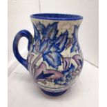 Charlotte Rhead for Crown Ducal jug, painted with blue and mauve flowers on cream ground, blue