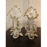 Pair of gilded white porcelain spill vases with crepe necks, encrusted with flowers to the bases,