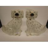 A pair of white and gilt Staffordshire dogs (32cm high)