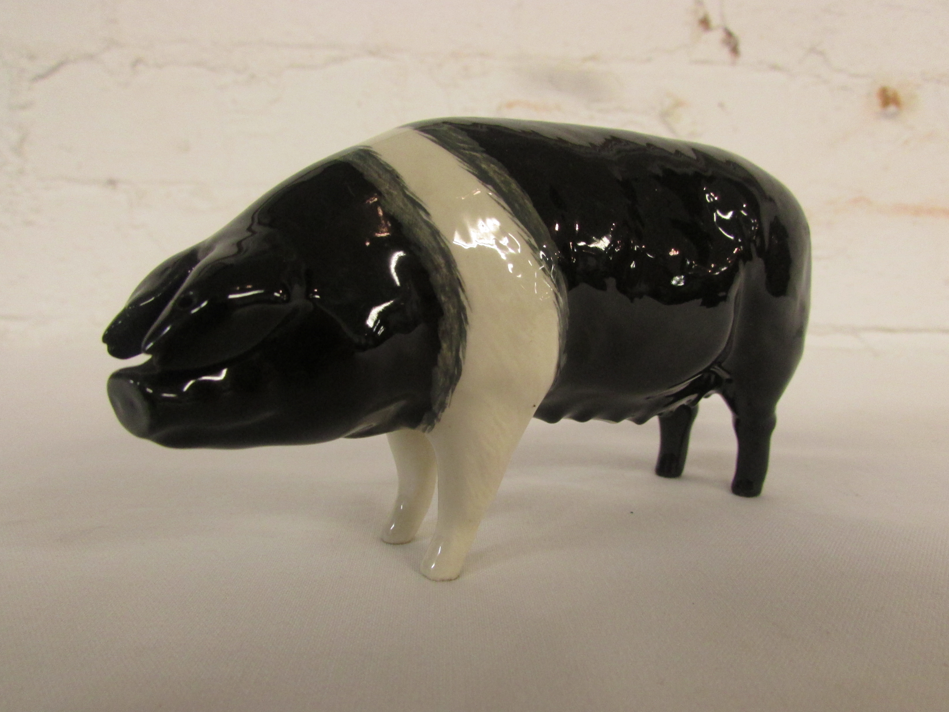 Beswick model of black pig CH. MERRYWOOD SILVER WINGS length 14.5cm, marked Beswick England