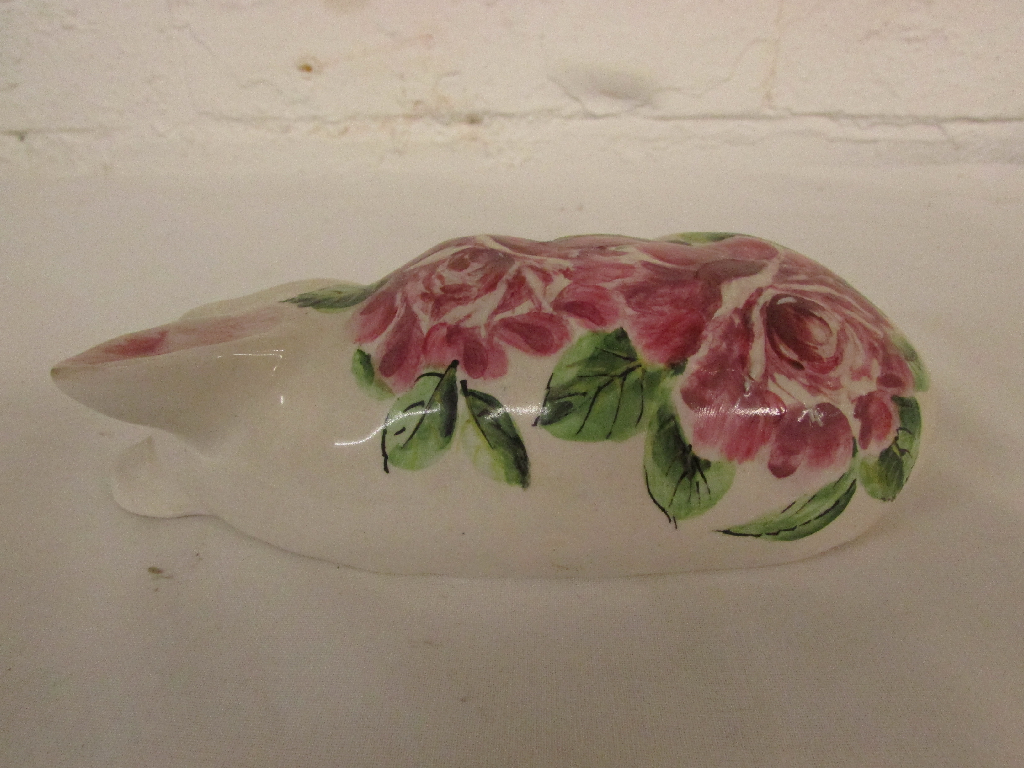 Exon Pottery Wemyss Ware Brian Adams figure of a sleeping pig, painted with pink roses and green - Image 2 of 3