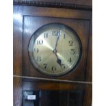 Oak case Grandmother clock, probably 1930's, with a brass dial and black enamelled Arabic chapter,