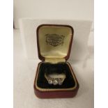 Three stone diamond engagement ring on 18ct gold shank with platinum setting, largest stone