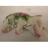 Exon Pottery Wemyss Ware Brian Adams figure of a sleeping pig, painted with pink roses and green