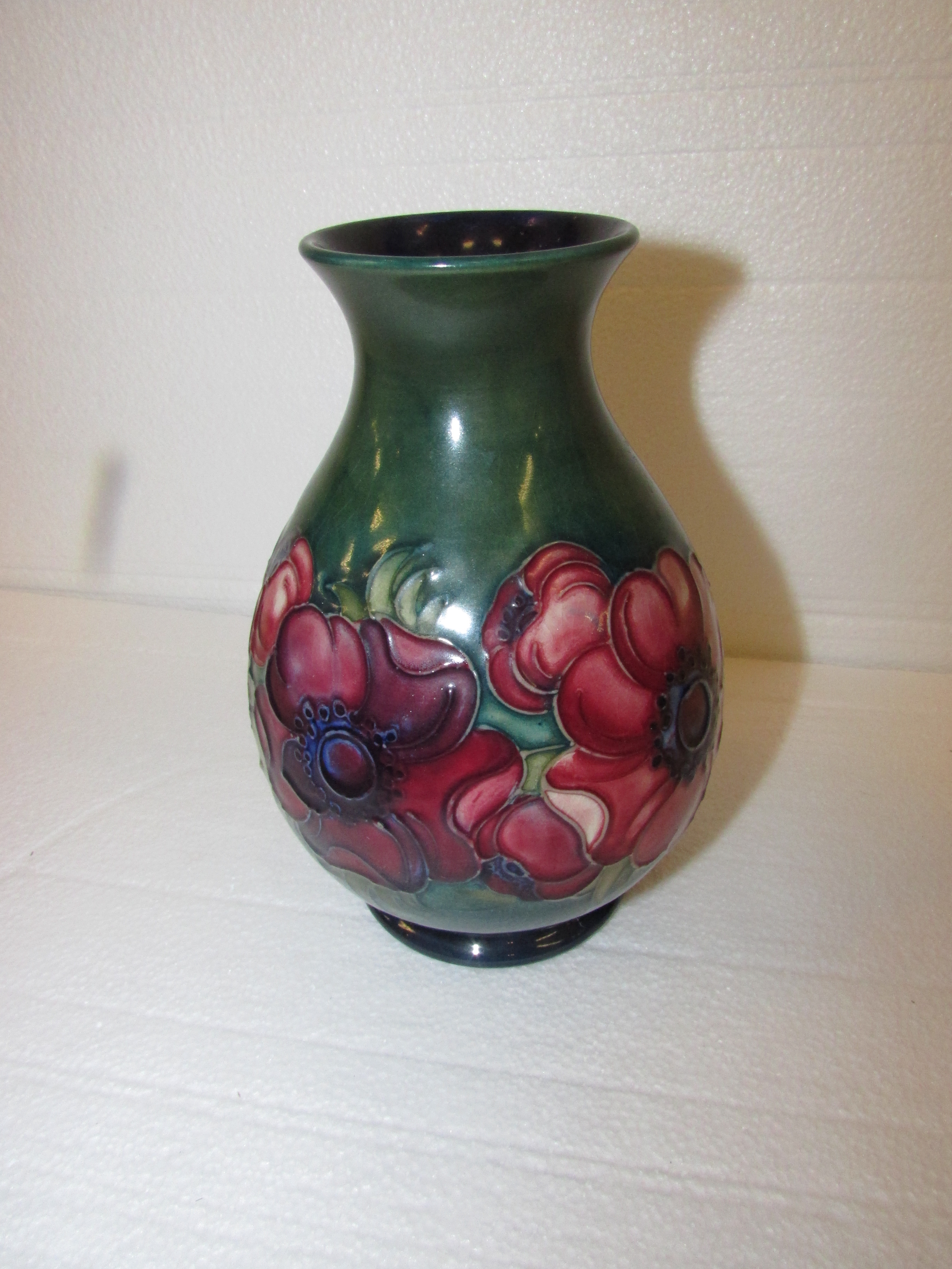 An initialled pinch necked ovoid Moorcroft vase decorated with anemone on green ground, W.A. - Image 3 of 4