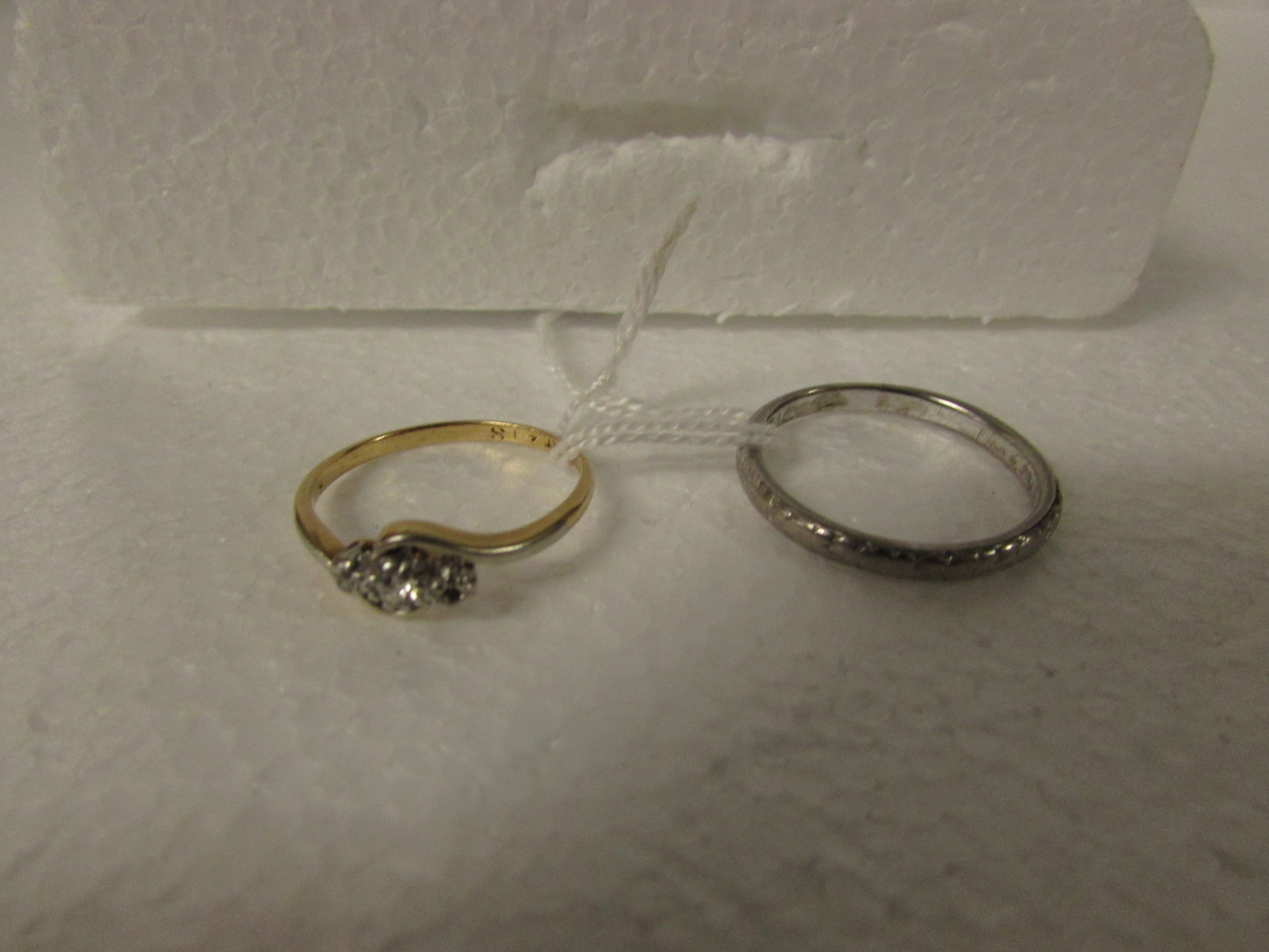 18ct white gold ring, 3.8g; and an 18ct gold diamond engagement ring with cross-over setting (one