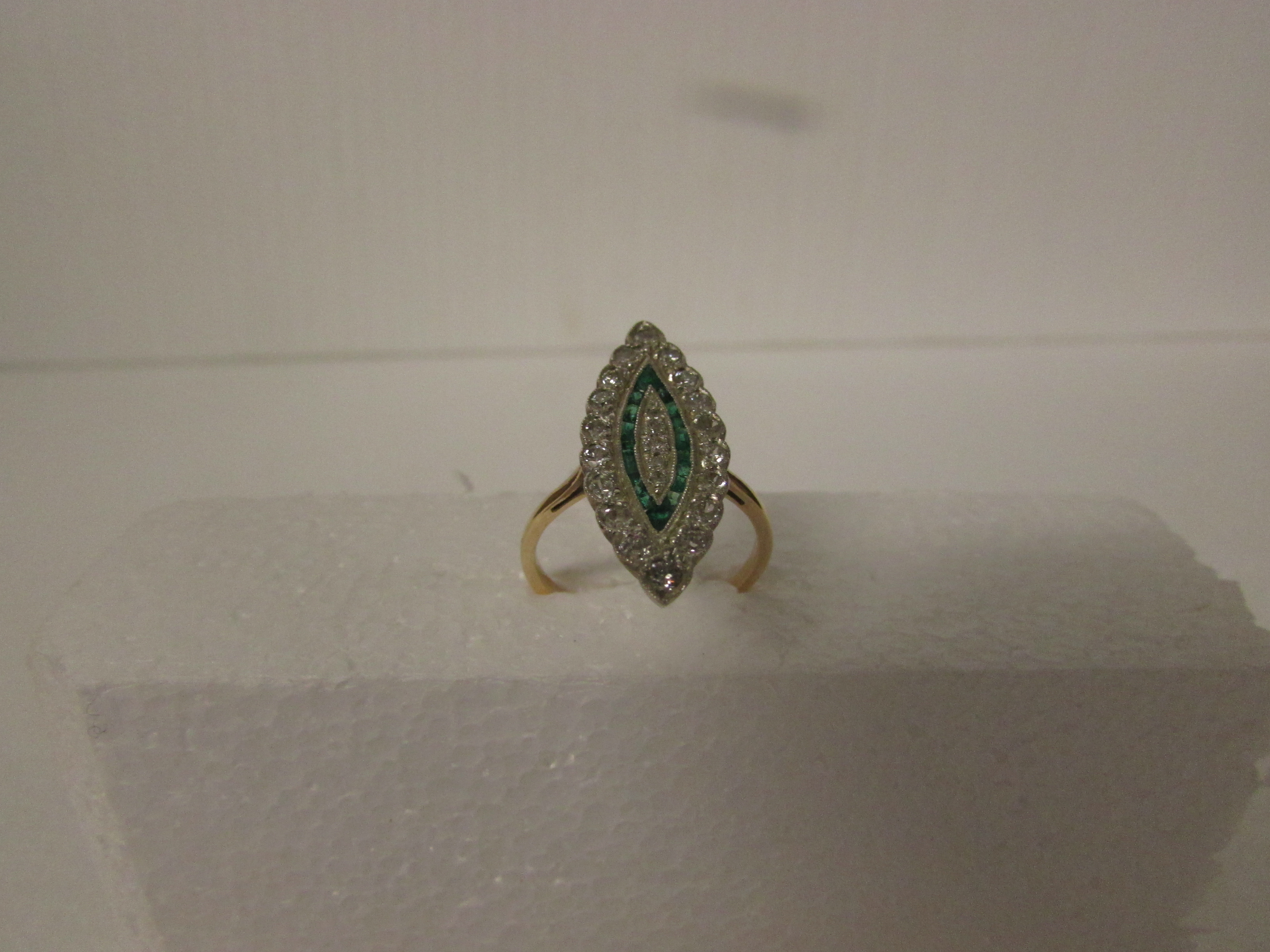 Diamond and emerald ring in a marquise setting (25mm x 10mm), perimeter of eighteen diamonds ( - Image 2 of 3