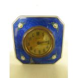 A French enamelled bedside clock, the case square with canted corners faced in deep blue engine