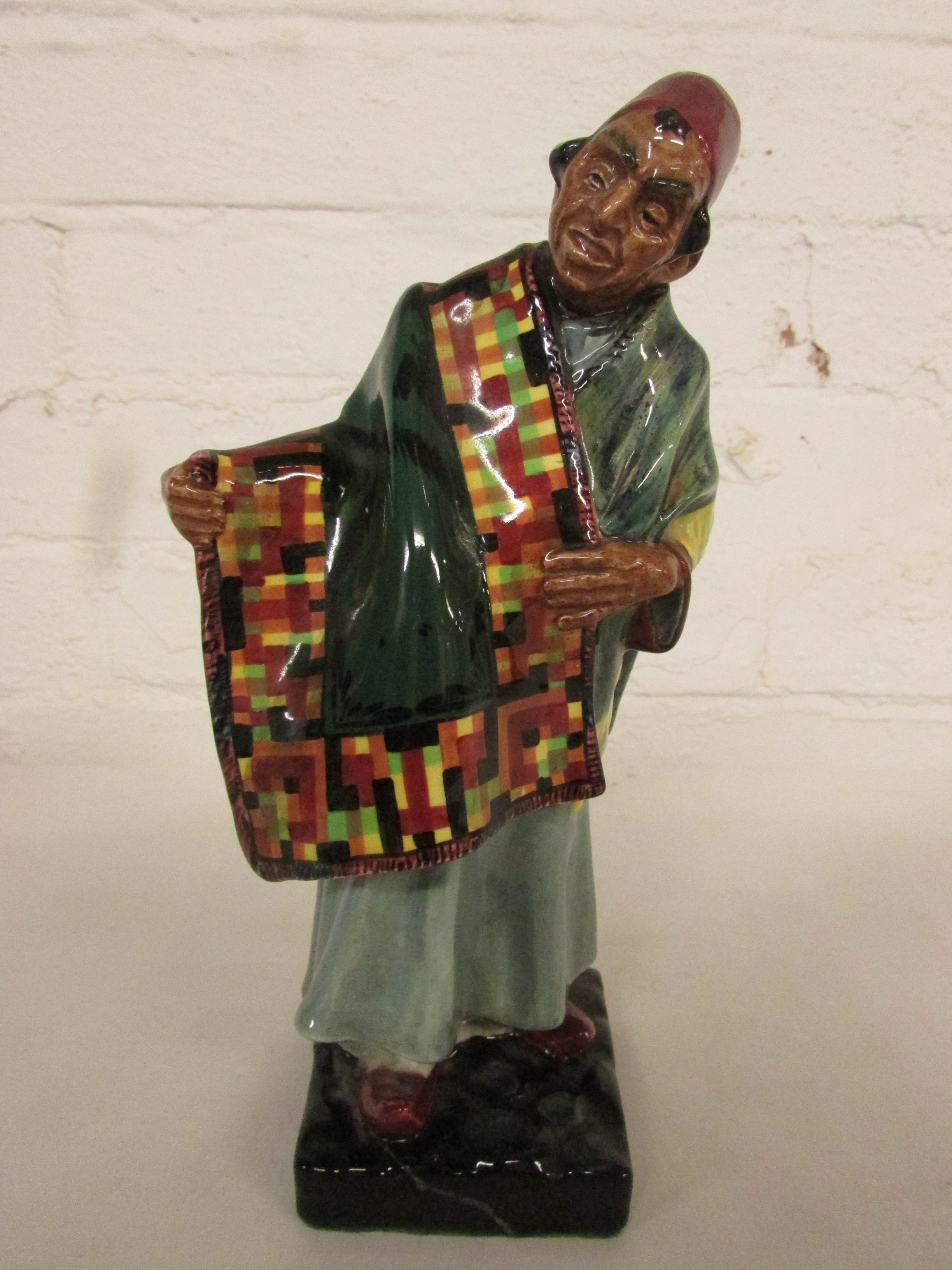 Royal Doulton figure 'Carpet Seller' HN1464 (damaged) height 22cm