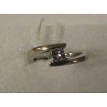 18ct white gold ring with solitaire diamond estimated at 0.25 carat in a crossover setting, total