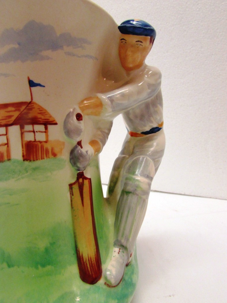 Burleigh Ware pottery cricket jug painted green and cream, the handle moulded as batsman, - Image 3 of 5