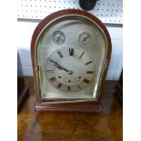An Edwardian mahogany dome shaped striking mantle clock with subsidiary slow /. fast and silent /
