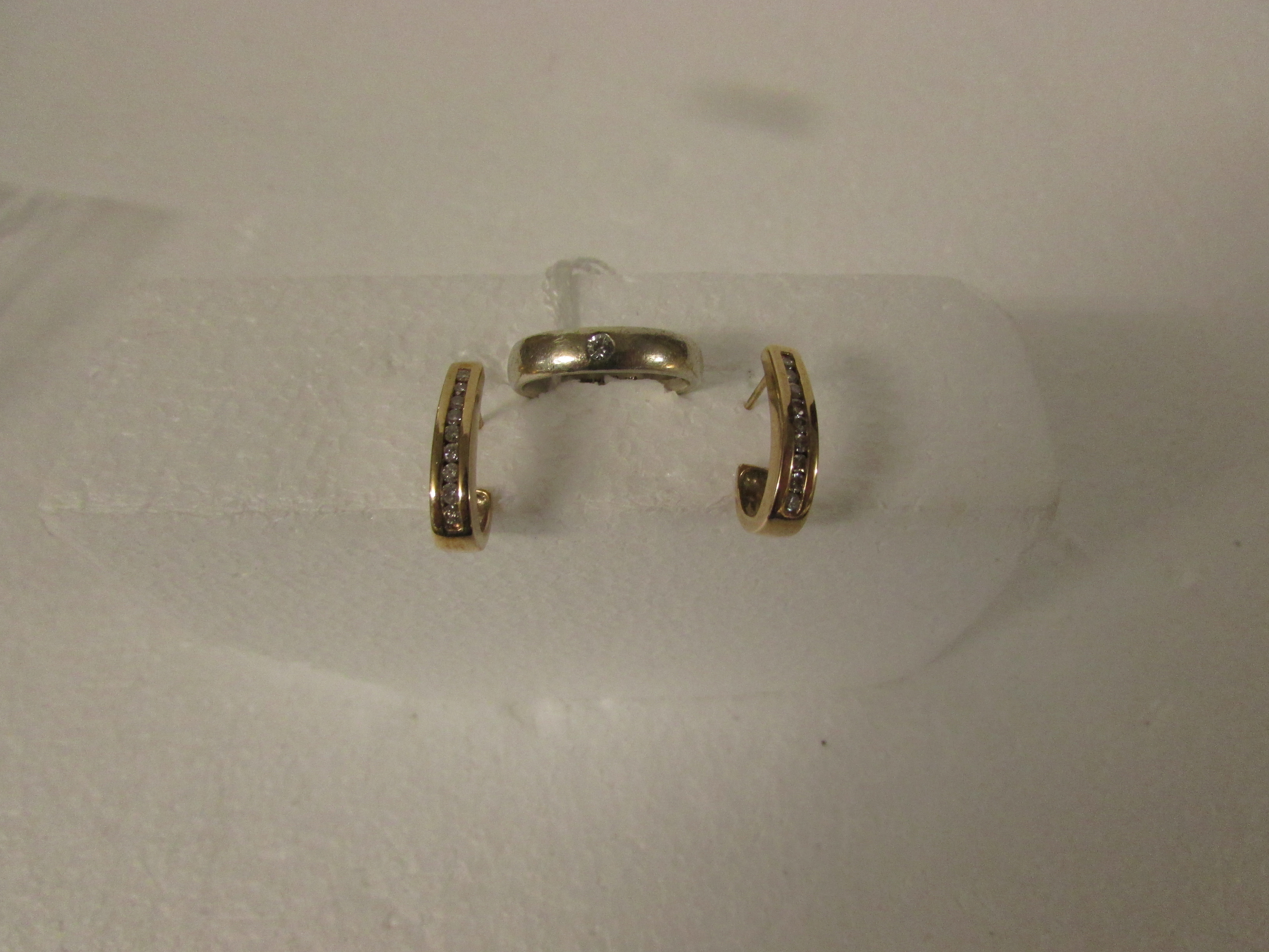 9ct gold ring set with small diamond in flush setting, (4.1g) and a pair of yellow metal earrings