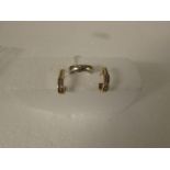 9ct gold ring set with small diamond in flush setting, (4.1g) and a pair of yellow metal earrings
