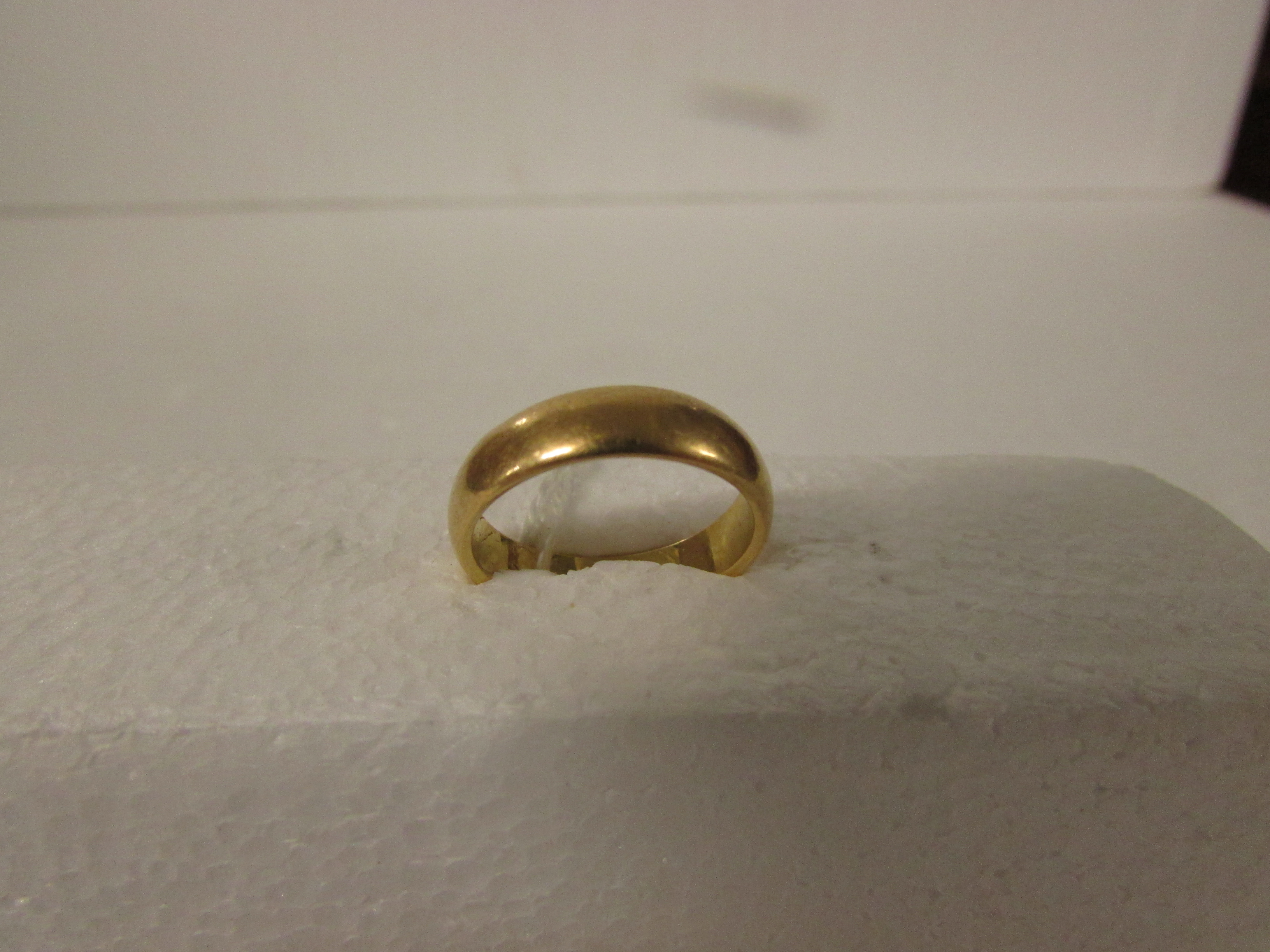 Yellow metal wedding ring, engraved 2.6.23 and initials within, no assay marks, 6.6g