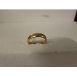 Yellow metal wedding ring, engraved 2.6.23 and initials within, no assay marks, 6.6g