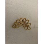 9ct gold brooch of looped form resembling a bunch of grapes, stamped 375, 6.8g