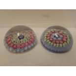 Two small millefiori paperweights each with concentric rings of pale blue, red and green canes,