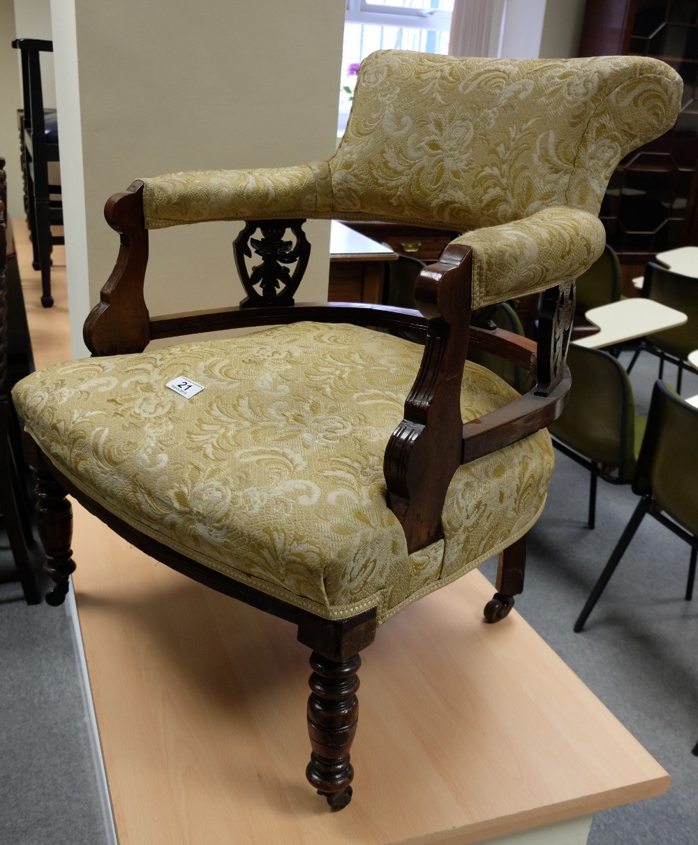 Edwardian carved walnut nursing armchair