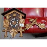 Carved wood cuckoo clock with weights