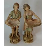 Pair of Large Early Royal Dux Figures of a Boy and Girl, each carrying a shell, pink triangle marks