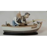 Lladro large figure Grandpa & Boy on boat fishing " Fishing with Gramps",on wood plinth.