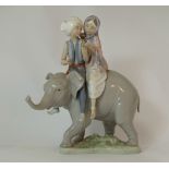Lladro figure Boy & Girl on Elephant, height 24cm ( Broken leg to young girl.