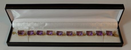 Gold and amethyst bracelet, 15ct or higher unmarked gold bracelet set with 10 amethyst stones,