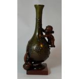 early 20th century french bronze vase decorated with embossed flowers and cupids on marble base,