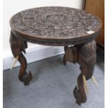 Indian early 20th century carved wood round table with 3 legs carved as Elephants heads with bone