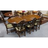 Reproduction Hepplewhite style extending inlaid Mahogany dinning table and a set of eight matching