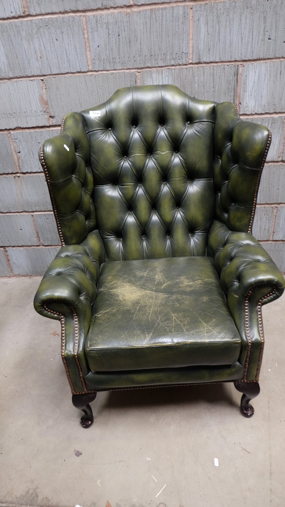 Green Leather high back Chesterfield style armchair on Queen Anne legs